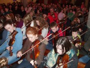 Fiddlers playing at Scoil Cheoil an Earraigh