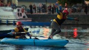 Laureen O'Dowd takes a fall while husband David steers the kayak. SHAKEDOWN THE TOWN, RTE TWO 