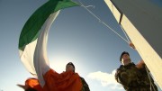 Nationwide 1916 - Members of the Defence Forces raising the flag