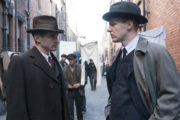 DR MOORE (Hugh O'Conor) confers with JIMMY (Brian Gleeson) in the tenements