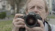 Shooting the Darkness - Photographer Stanley Matchett with his camera in Derry in Shooting the Darkness