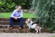 Paul Howard and Humphrey his dog in garden. Photo by Adrian McCarthy