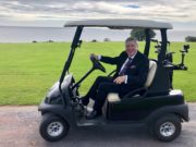 FRANCIS BRENNAN IN GOLF BUGGY