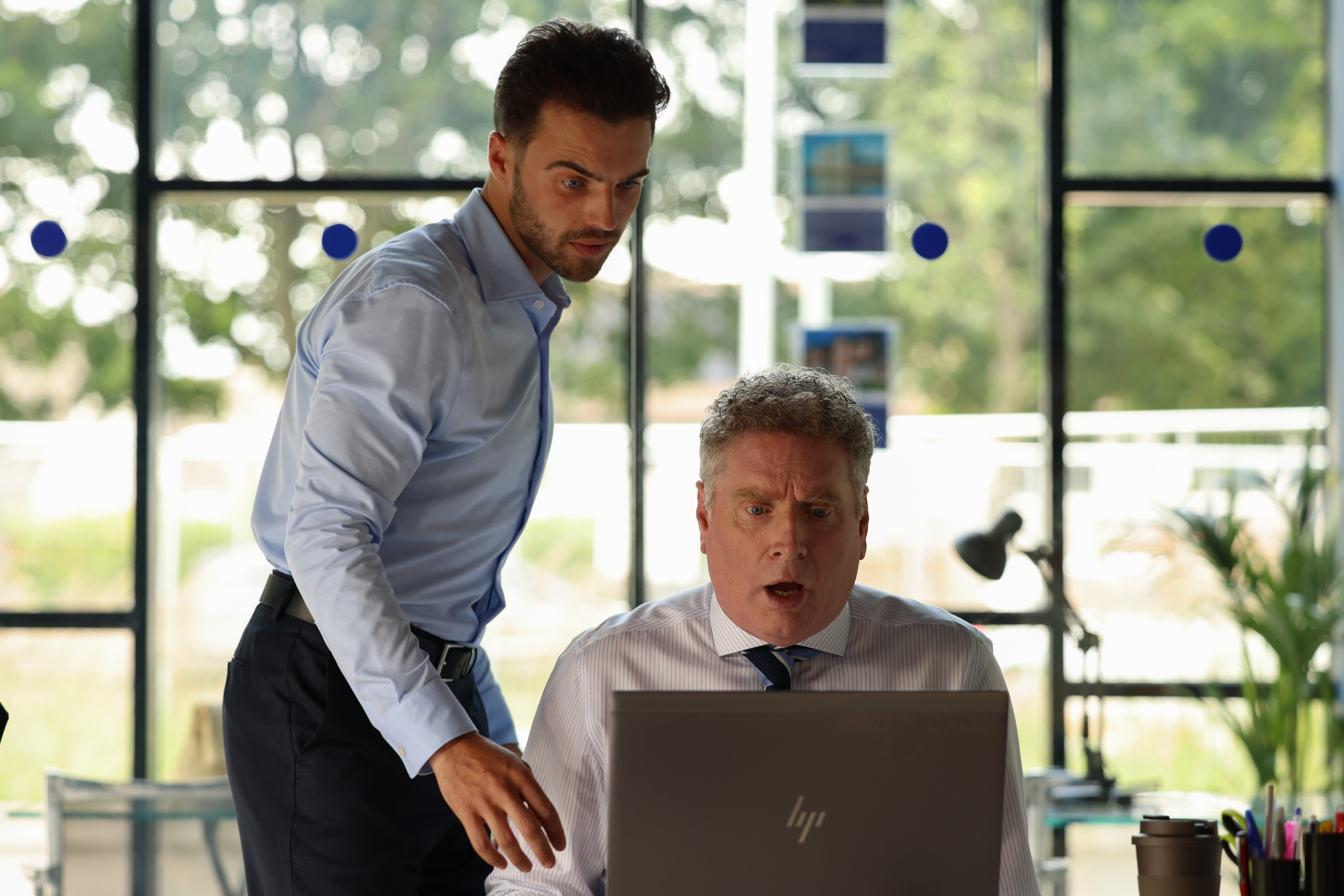 Ant Sheridan (Adam Richardson) and Eddie (Bryan Quinn) in an office in the The Dry